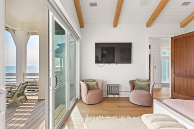 Anchored in the exclusive Palm Court enclave just south of 30A