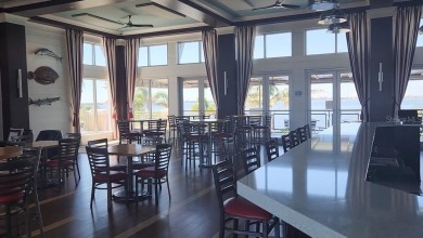 Luxury Coastal Living Awaits you at this beautiful elevated Key