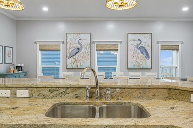 HIGHLIGHTS: - Beachfront beauty - Gorgeous Gulf views - 3 levels