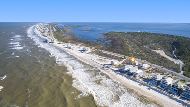 HIGHLIGHTS: - Beachfront beauty - Gorgeous Gulf views - 3 levels