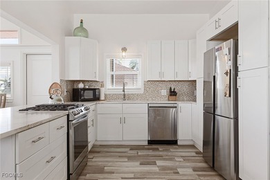 This beautifully remodeled 2-bedroom, 2.5-bath waterfront POOL