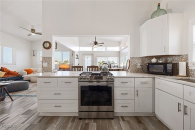 This beautifully remodeled 2-bedroom, 2.5-bath waterfront POOL