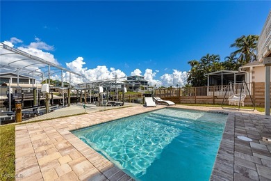 This beautifully remodeled 2-bedroom, 2.5-bath waterfront POOL