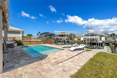 This beautifully remodeled 2-bedroom, 2.5-bath waterfront POOL