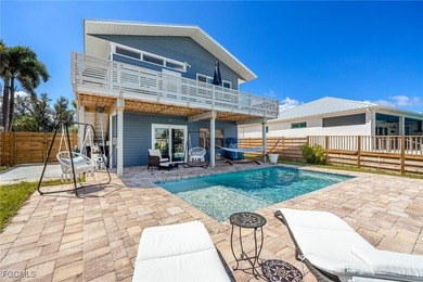 This beautifully remodeled 2-bedroom, 2.5-bath waterfront POOL