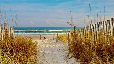 Experience elevated coastal living on highly sought-after