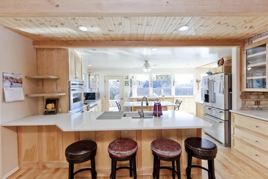 AWESOME! No HOA. 1 acre in town. In a private setting is a 5