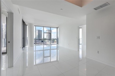 Welcome to this 19th floor corner unit boasting bay views and