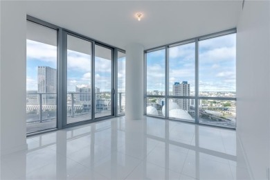 Welcome to this 19th floor corner unit boasting bay views and