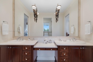 Inside guard-gated Islands of Cocoplum, this individually gated