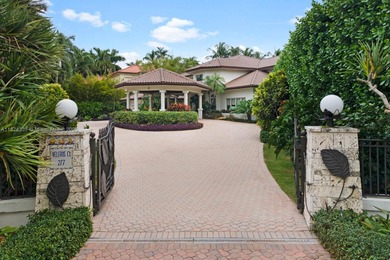 Inside guard-gated Islands of Cocoplum, this individually gated