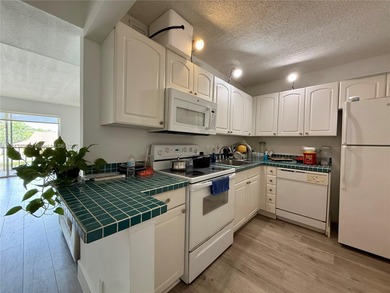 This beautifully maintained 2 bed, 2 bath condo is currently
