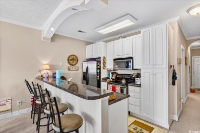 Welcome to this 3 bedroom, 2 bathroom condo in the gated