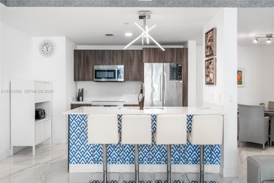 Welcome to Unit 4309 at Aria on the Bay -- a bright and spacious