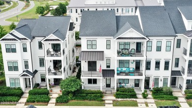 Welcome to an exquisite PBC designed townhome nestled in the