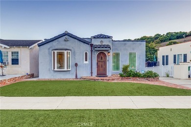Welcome to this beautifully renovated Spanish-style home