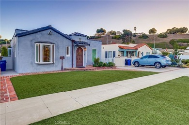 Welcome to this beautifully renovated Spanish-style home