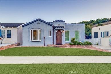 Welcome to this beautifully renovated Spanish-style home