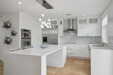 Experience luxury waterfront living in this impeccably