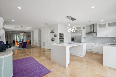 Experience luxury waterfront living in this impeccably