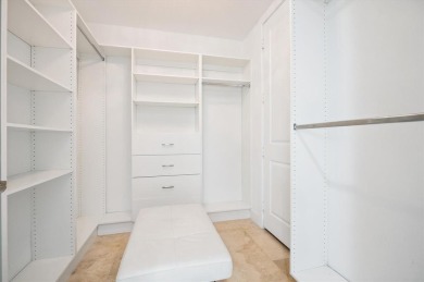 Experience luxury waterfront living in this impeccably