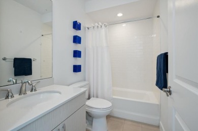 Experience luxury waterfront living in this impeccably