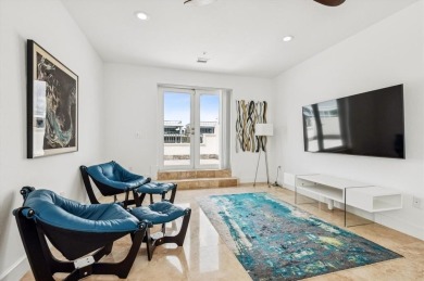 Experience luxury waterfront living in this impeccably