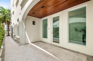 Experience luxury waterfront living in this impeccably