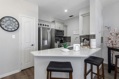 Stunning renovated end-unit condo is located next to the