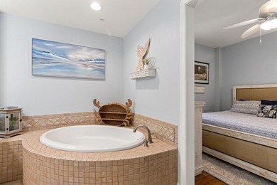 Discover the ultimate coastal living in Unit 1N at The Club at