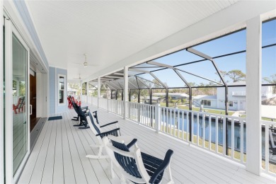 Completed in 2021, this CUSTOM-DESIGNED WATERFRONT RETREAT