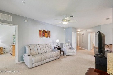 Welcome to this charming ground-level, end unit condo in the