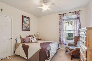 Welcome to this charming ground-level, end unit condo in the