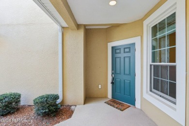 Welcome to this charming ground-level, end unit condo in the