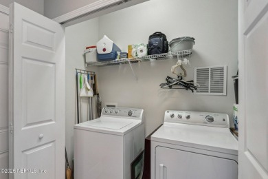 Welcome to this charming ground-level, end unit condo in the