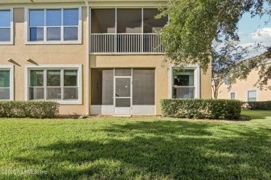 Welcome to this charming ground-level, end unit condo in the