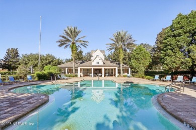 Welcome to this charming ground-level, end unit condo in the