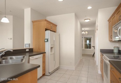 Welcome to Villas at Waterside Unit 100B, a meticulously