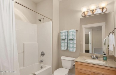 Welcome to Villas at Waterside Unit 100B, a meticulously