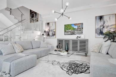 Newer construction-corner 2-story condo w/floor-to-ceiling glass