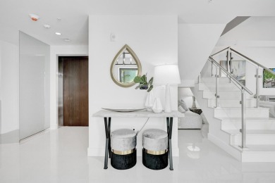 Newer construction-corner 2-story condo w/floor-to-ceiling glass