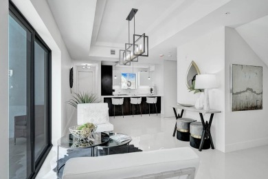 Newer construction-corner 2-story condo w/floor-to-ceiling glass