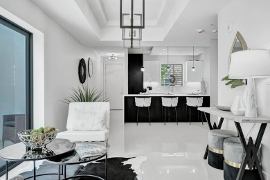 Newer construction-corner 2-story condo w/floor-to-ceiling glass