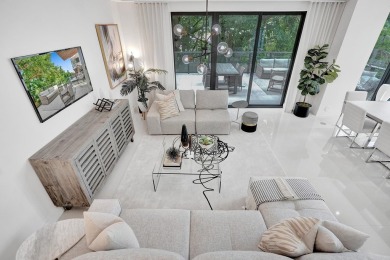 Newer construction-corner 2-story condo w/floor-to-ceiling glass