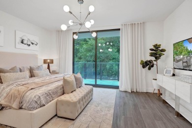 Newer construction-corner 2-story condo w/floor-to-ceiling glass