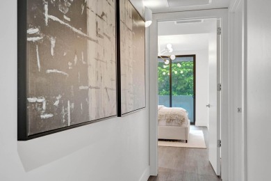 Newer construction-corner 2-story condo w/floor-to-ceiling glass