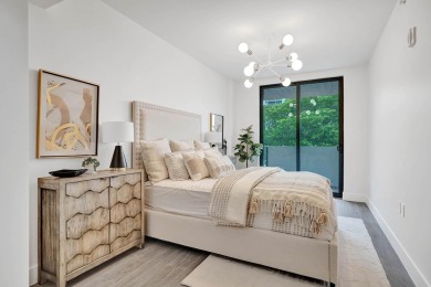 Newer construction-corner 2-story condo w/floor-to-ceiling glass