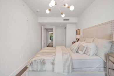 Newer construction-corner 2-story condo w/floor-to-ceiling glass