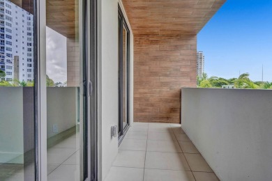 Newer construction-corner 2-story condo w/floor-to-ceiling glass