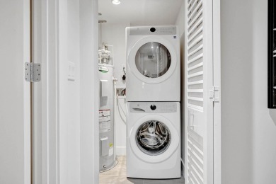 Newer construction-corner 2-story condo w/floor-to-ceiling glass